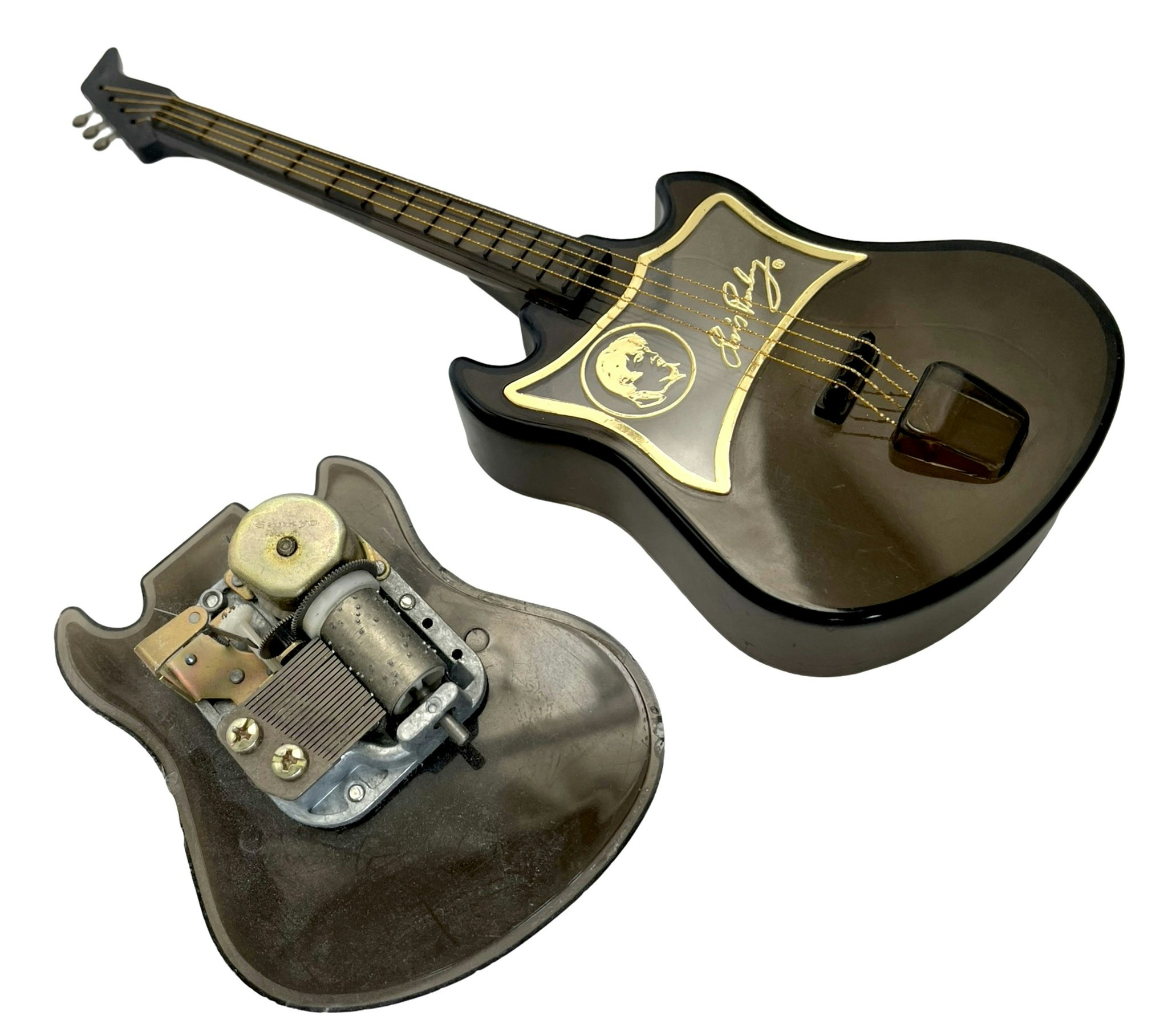 Elvis' guitar-shaped music box - spins and plays the song Love Me Tender