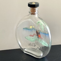 Äldre fick flaska plunta för sprit, bemålat glas