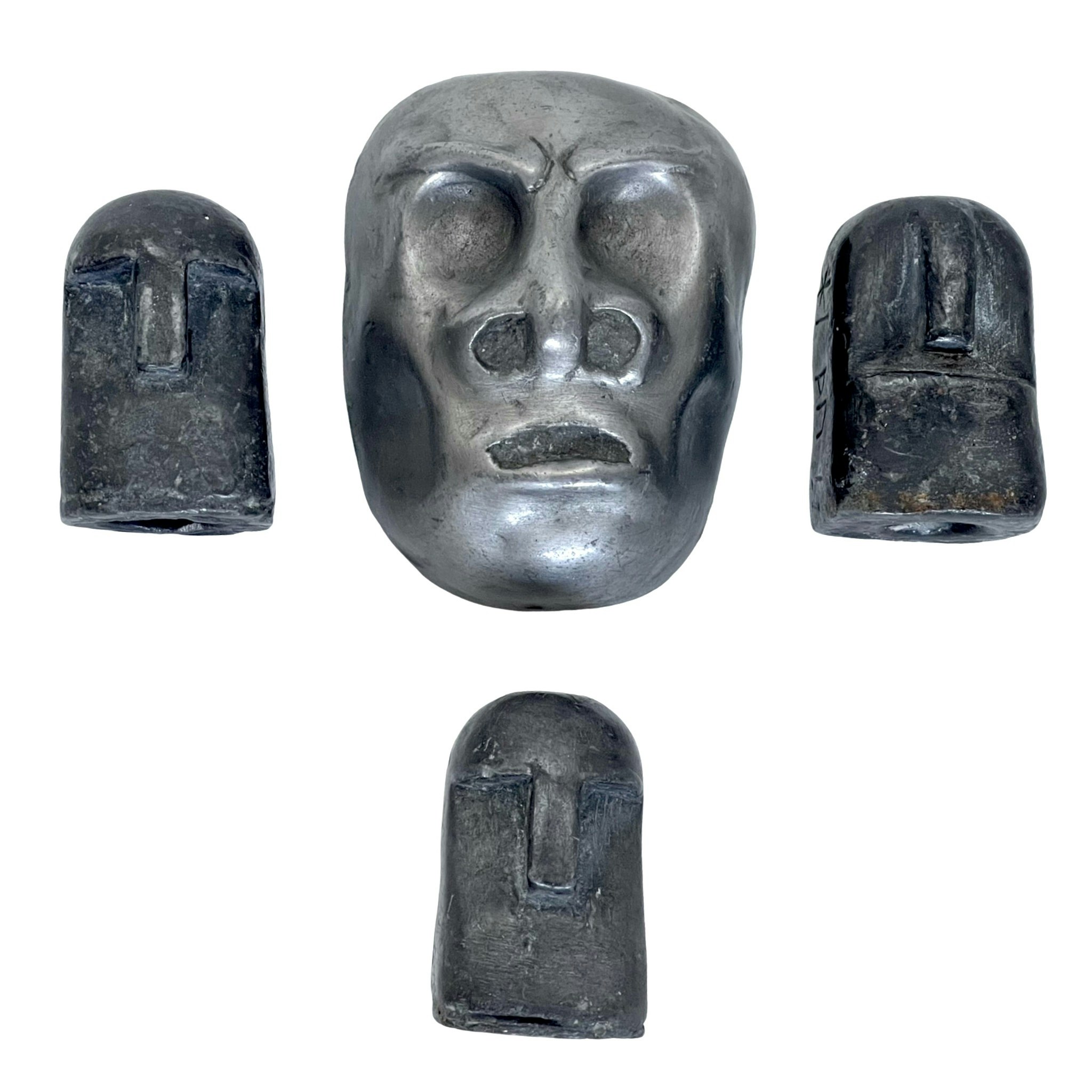 Skulpturer i form av ett ansikte och Sumba, signerad