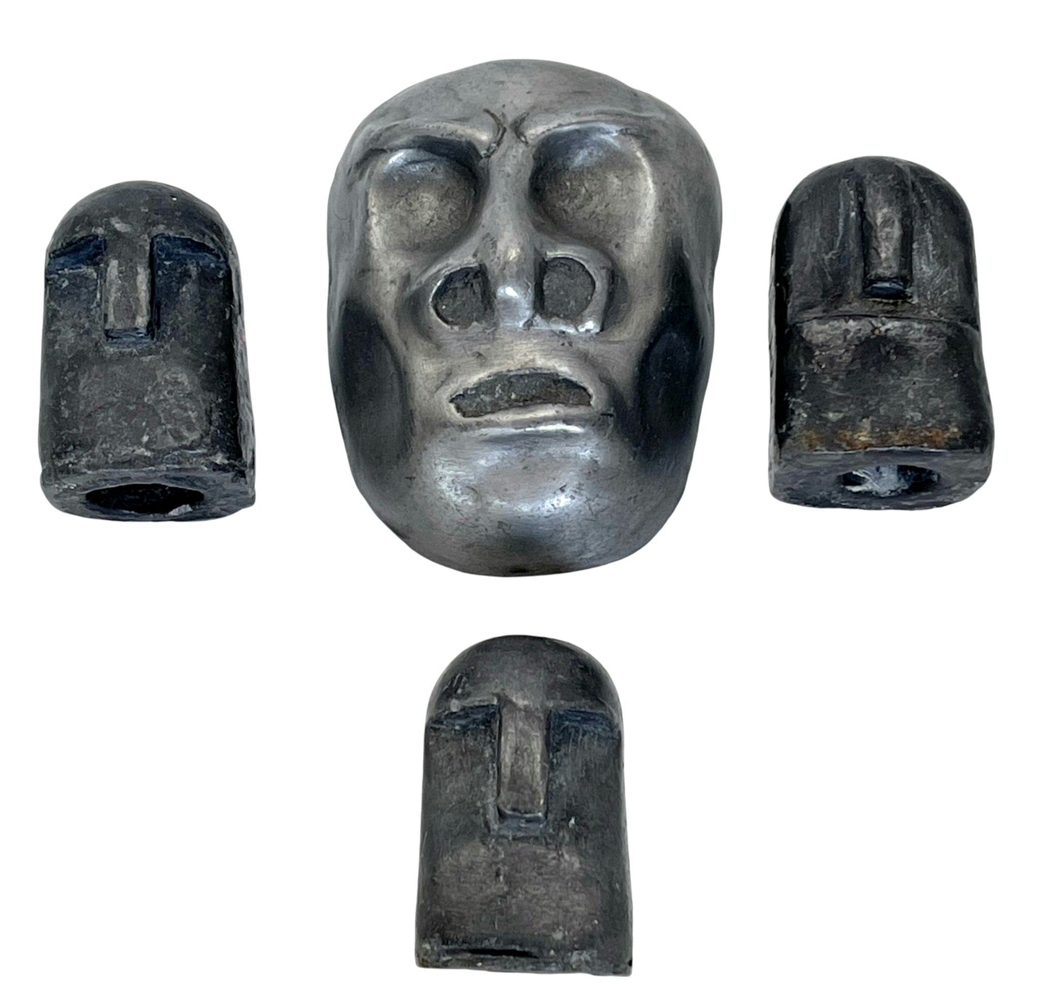 Skulpturer i form av ett ansikte och Sumba, signerad