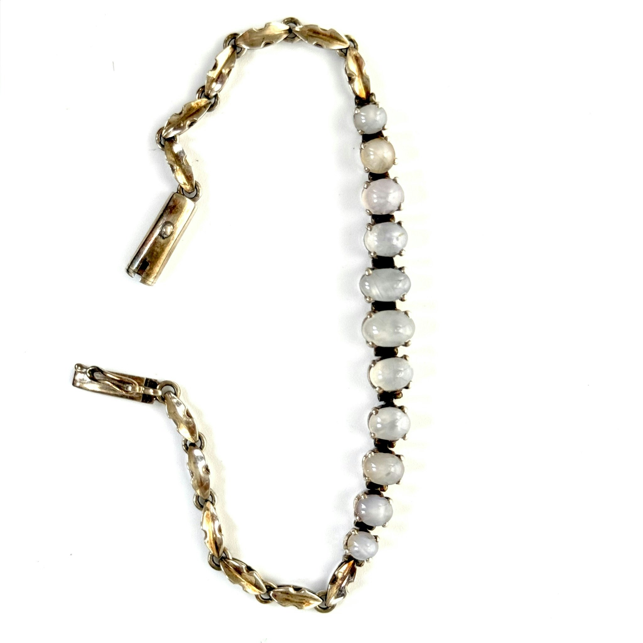 ARMBAND mittdekor av 11 stjärnsafirer