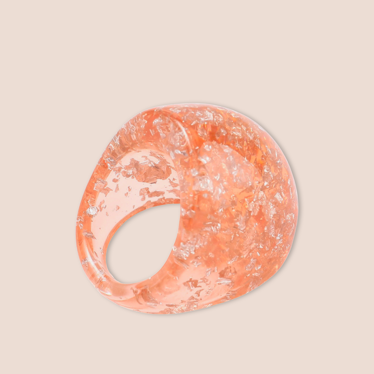 Stor aprikosfärgad glittrig ring