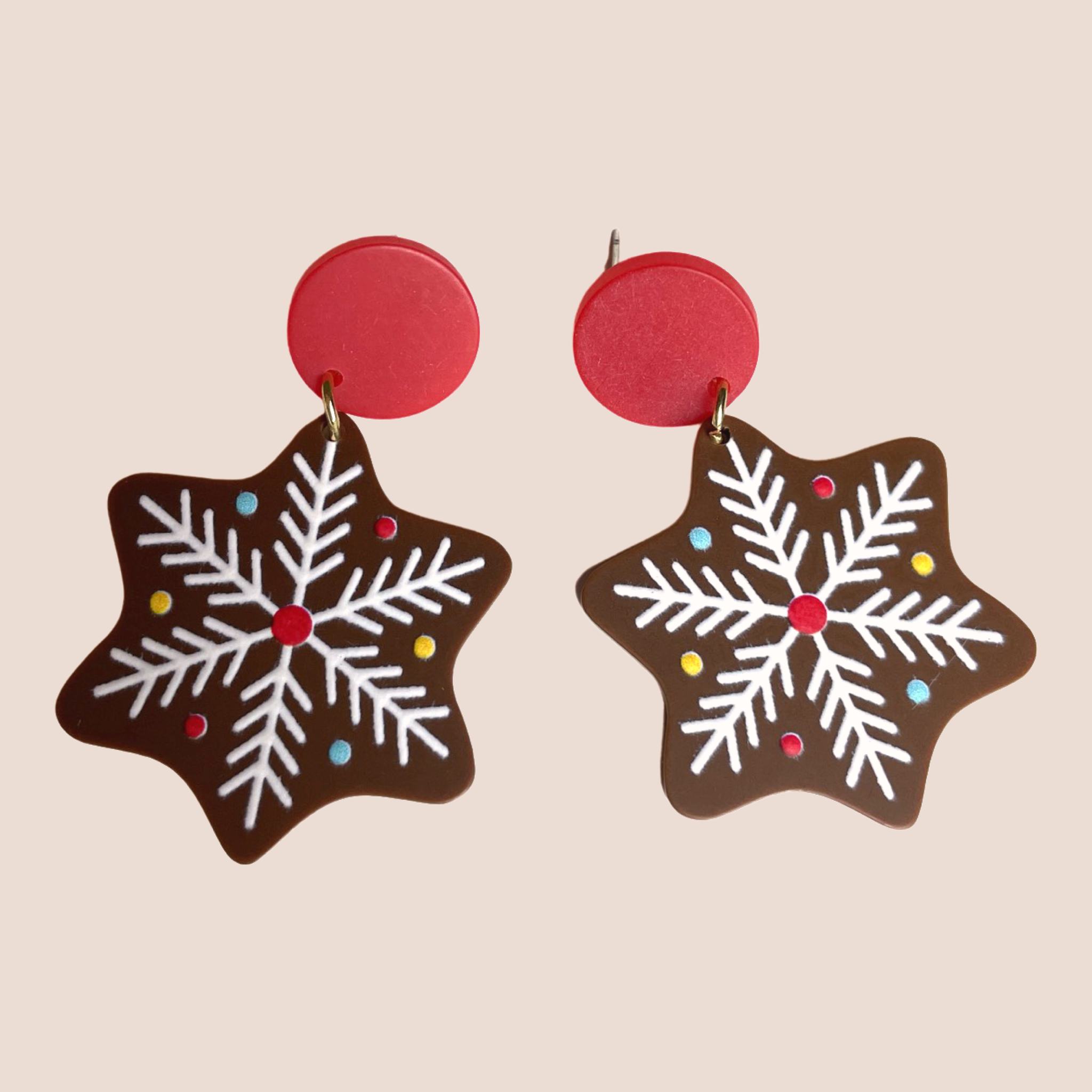 Julörhängen med motiv av pepparkakor och snöflingor