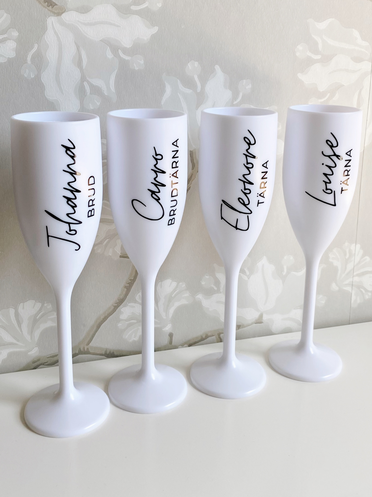 Vitt Champagneglas med tryck