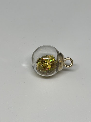 Glaskula med stjärnglitter - Guld