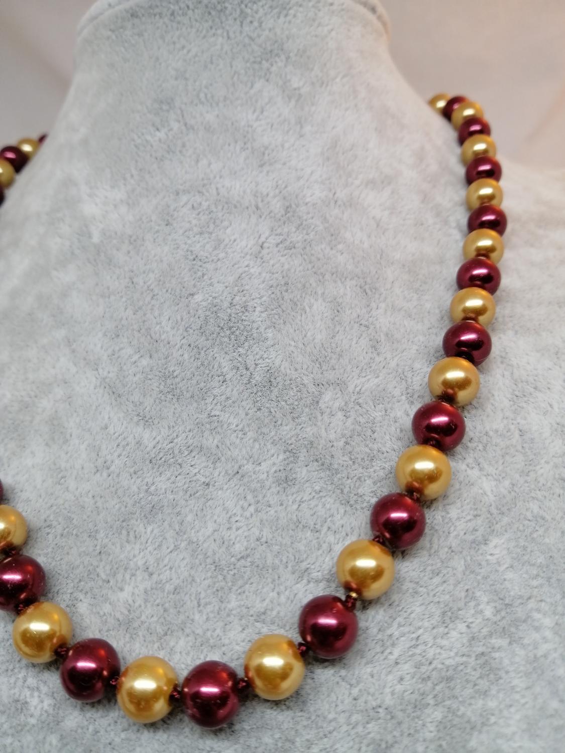 Bijouteri halsband armband set röda och guldfärgade pärlor