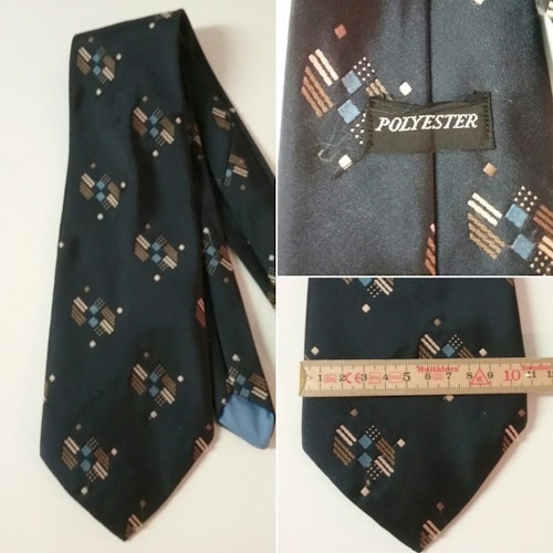 Vintage retro bredare slips 70-tal blå-svart med beigebrunt mönster i fält