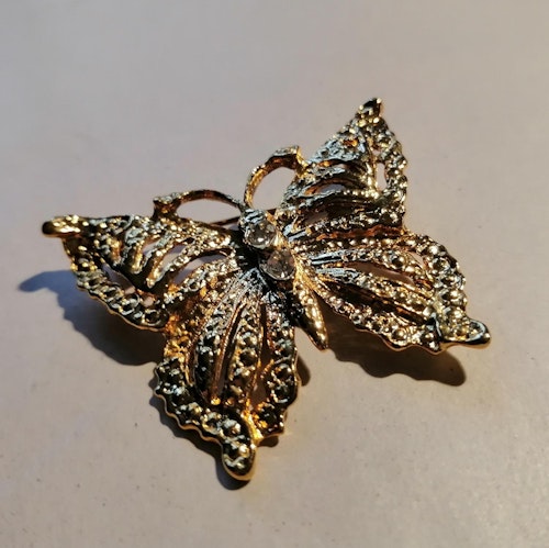 Second hand bijouteri brosch guldfärgad fjäril med glittersten