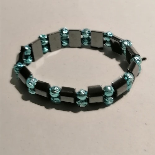 Second hand bijouteri smycke elastiskt armband turkos pärlor grafitgrå länkar