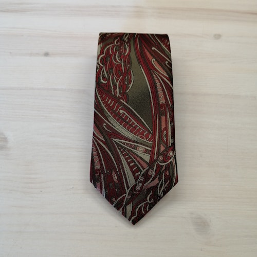 Second hand slips mönstrad i slingor olivgrönt rött ljusare olivgrönt