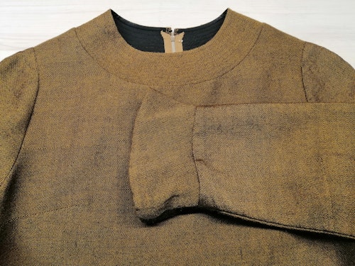 Vintage klänning i ull brun-aktig med rand nertill fodrad 60-tal