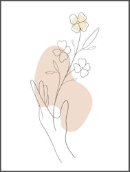 Handen med blomma