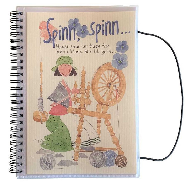spiralbunden anteckningsbok med texten: ”Spinn, spinn.