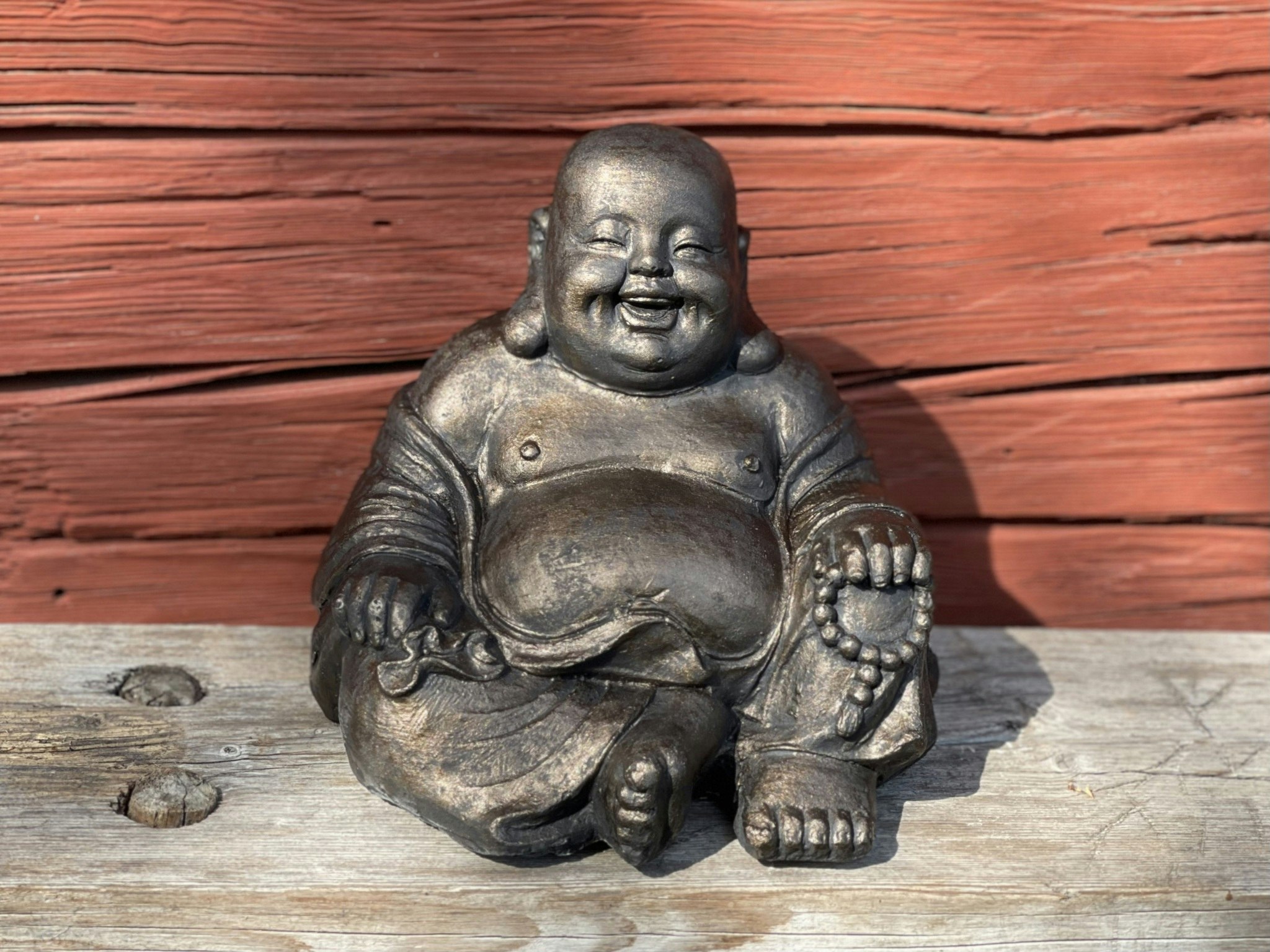 Fet, glad buddha