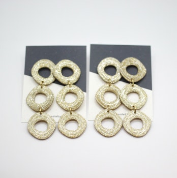 Uneven circle (guld/glitter)