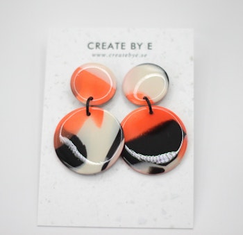 Glossy circle (svart/orange melerad)