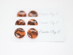 Glossy studs (orange/mönster)