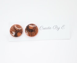 Glossy studs (orange/mönster)