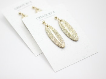 Oval (guld/glitter/gloss)
