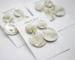 Glossy circle (vit/guldglitter)