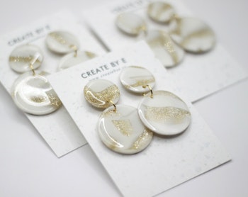 Glossy circle (vit/guldglitter)