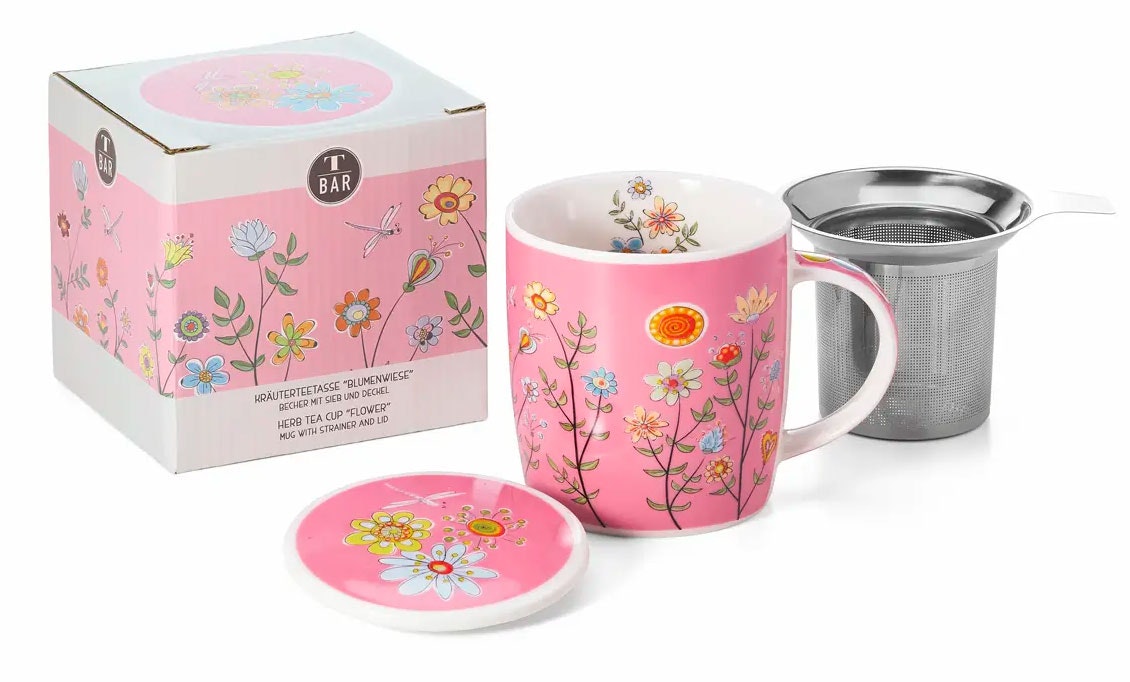 En örtte kopp dekorerad med en himmelsk blomsteräng. Innehåller även sil i rostfritt stål och lock i en dekorativ presentförpackning.