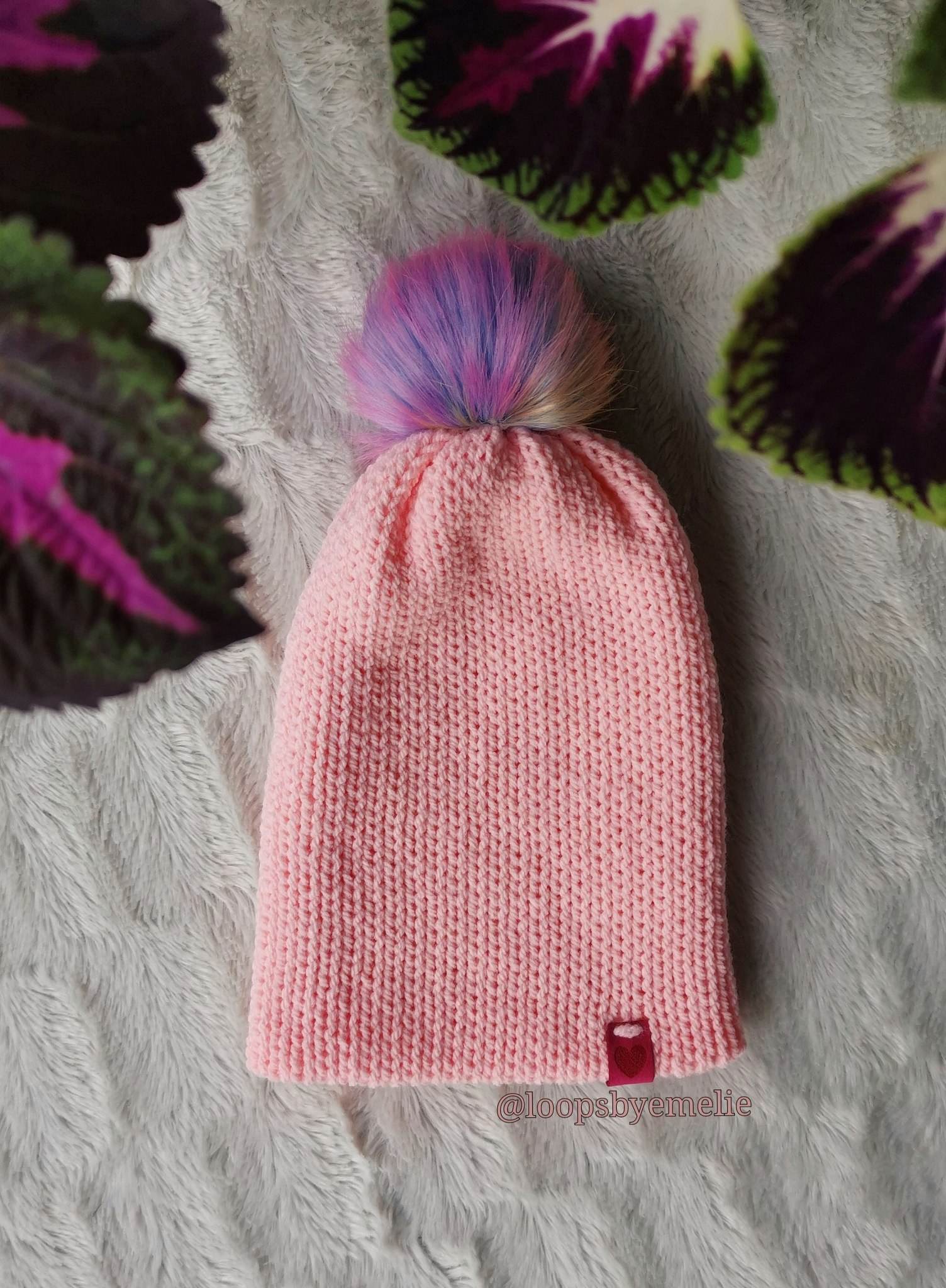 Dubbelstickad mössa med pompom