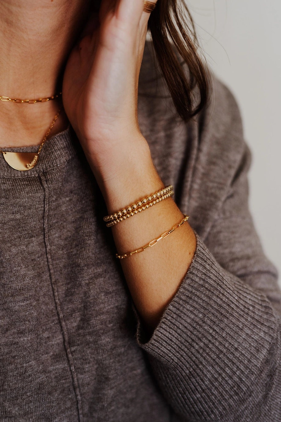 Kono & Co: Curb and Oval Gold Bracelet