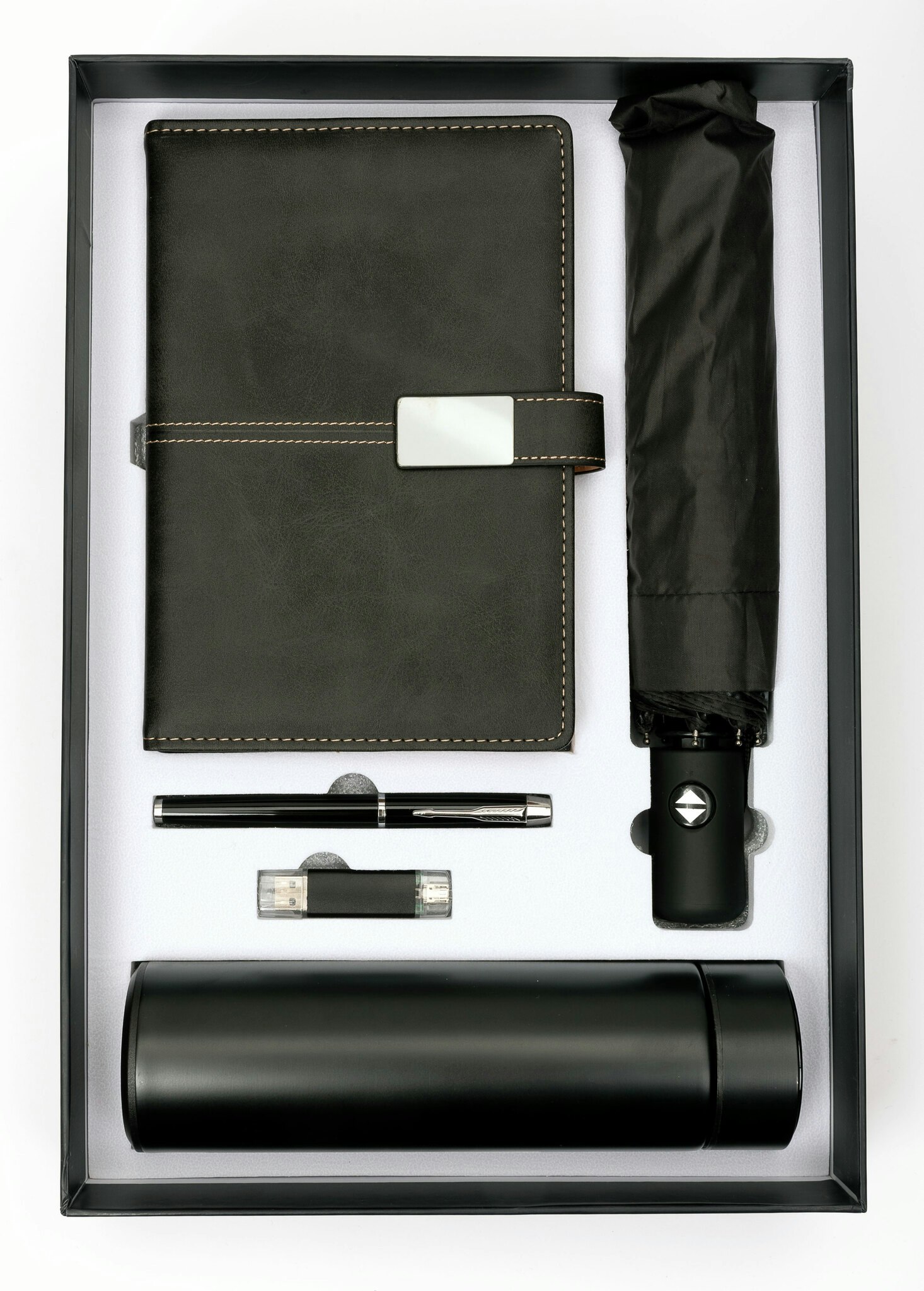 Presentbox med anteckningsbok, penna, paraply, USB-sticka och termos
