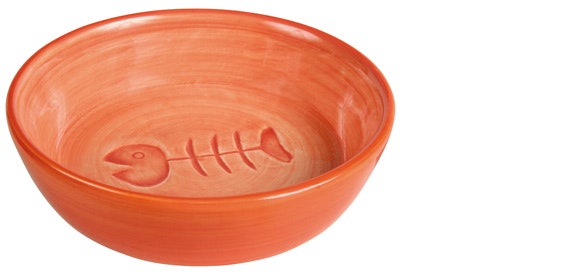 En orange keramikskål med fiskbensmotiv.
