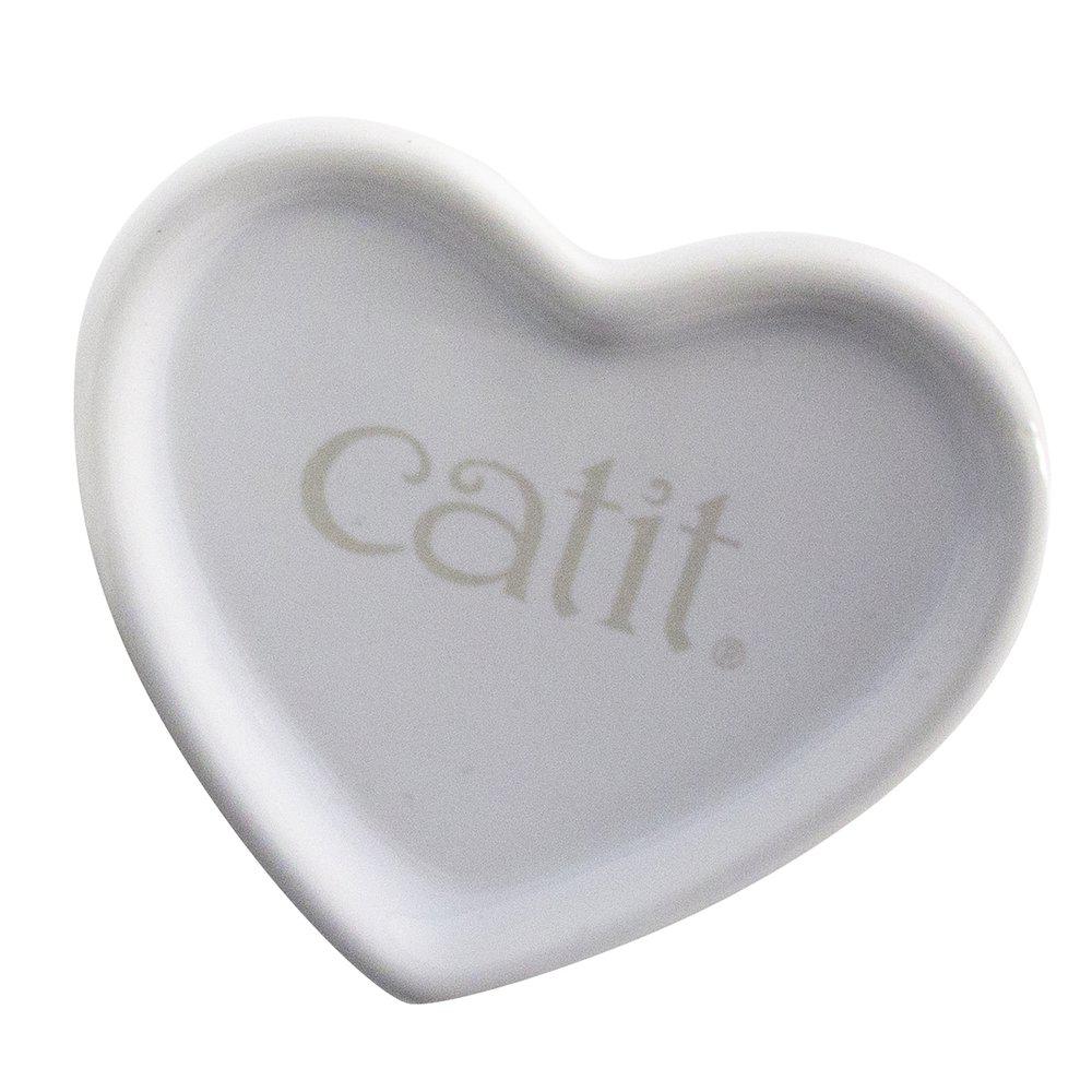 En gullig liten vit kattskål som är formad som ett hjärta. Texten "catit" hittas på insidan av skålen.