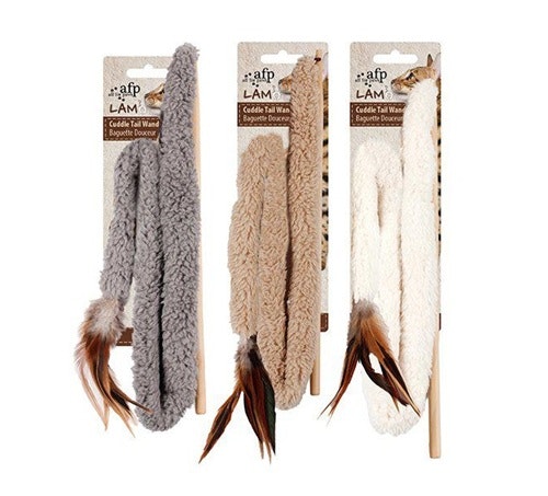 Tre stycken svansvippor i olika färger. En grå, en beige och en vit.