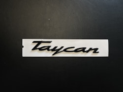 Porsche Taycan emblem i svart