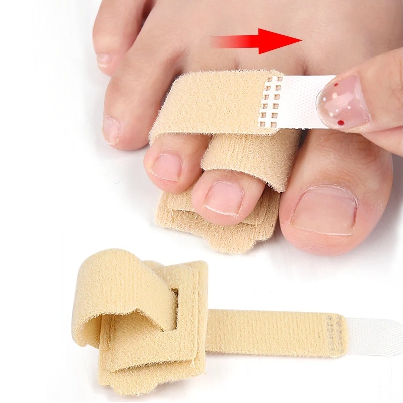Hammartå stabiliserande band med stöd