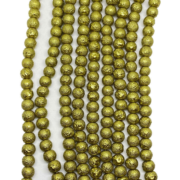 Strukturpärlor 6 mm guldgröna
