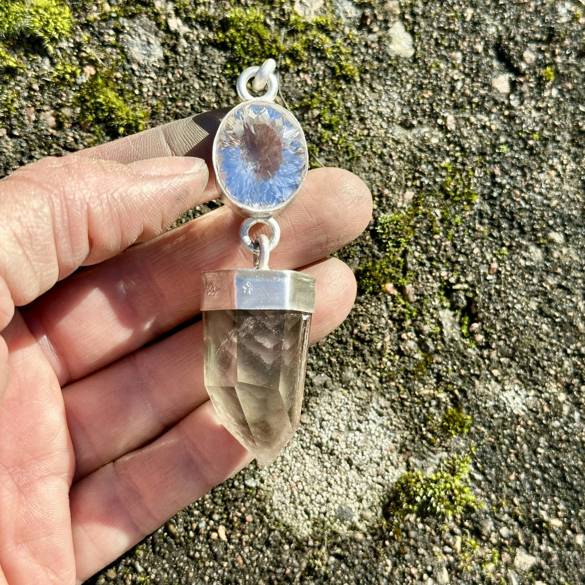 Faceted quartz crystal with lodolite full of phantoms