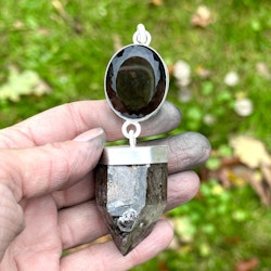 Large faceted smoky quartz with dark Lodolite