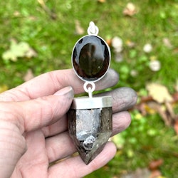 Large faceted smoky quartz with dark Lodolite