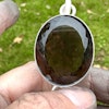 Large faceted smoky quartz with dark Lodolite