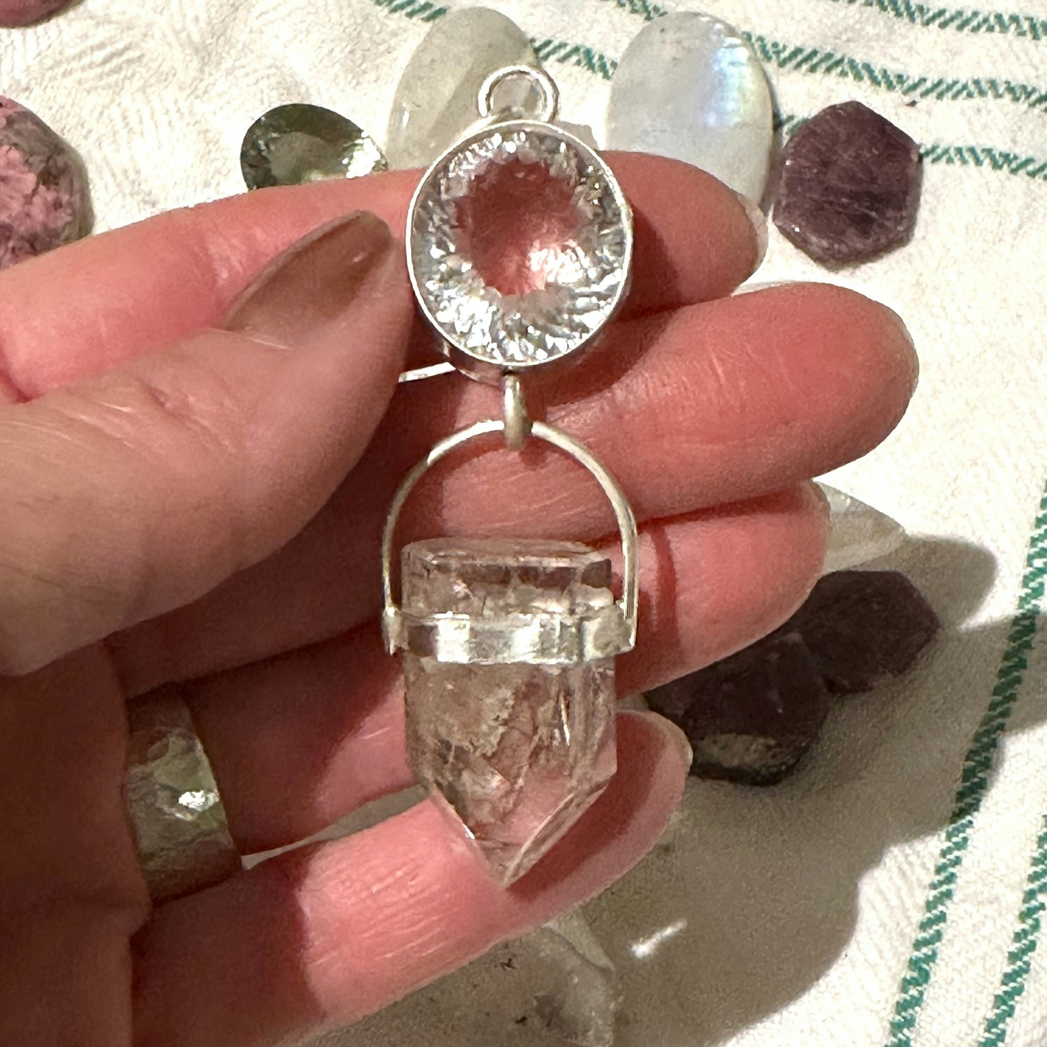 Faceted quartz crystal with lodolite with rutile quartz