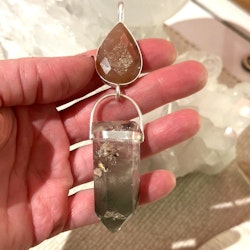 Faceted natural moonstone with lodolite full of phantoms