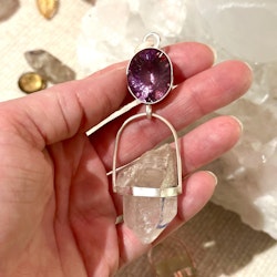 Faceted amethyst with double terminated Enhydro from the Himalayas with a small baby crystal on the side.