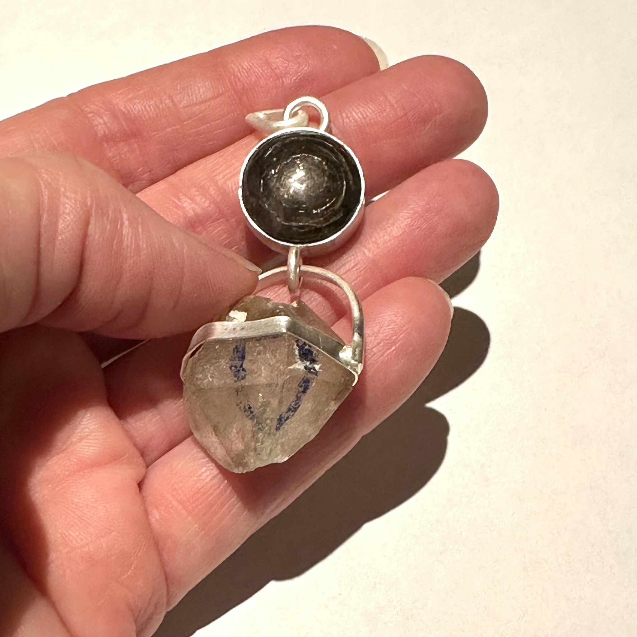 Black star Star sapphire with double terminated rock crystal with Enhydro from the Himalayas