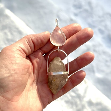 Rose quartz with double terminated Enhydro clear quartz crystal from the Himalayas