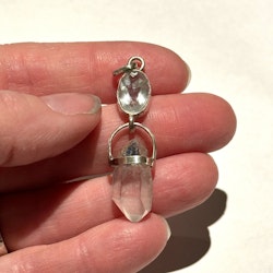 Faceted aquamarine with double-terminated Dumortierite quartz