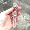Facettslipad bergkristall med dubbelterminerad Lemurien kristall