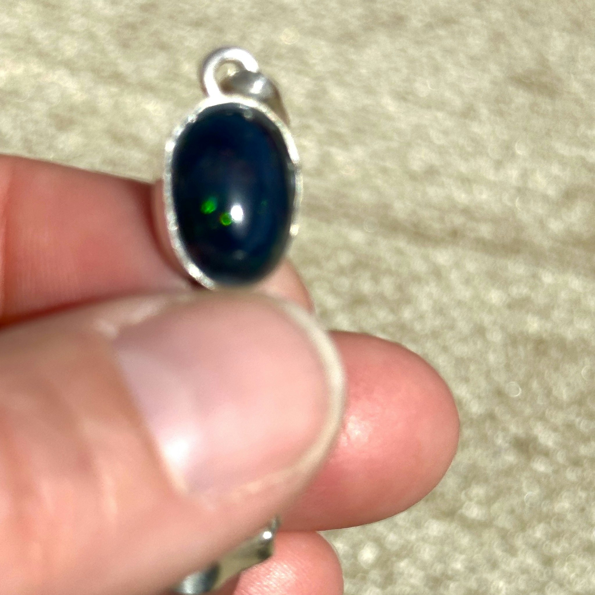 Black opal with double terminated pink Lemurian