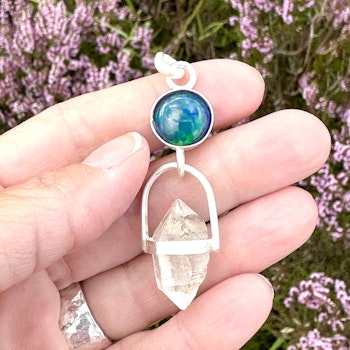 Dragons eye- black opal with double terminated clear quartz.