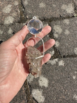 Silver wolf light portal- clear Quartz with amazing Rutilated Quartz with a raw side.