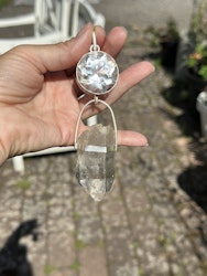 Light portal of the hidden lights of cosmos Clear Quartz light portal with  Enhydro Quartz from the Himalayas with moving sand/stardust in the water.